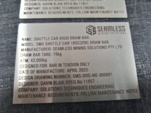 Laser engraved stainless steel compliance label with logo, text and barcode, manufactured in Townsville Queensland